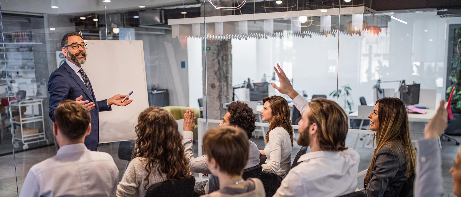 Business man giving training to team in a conference room